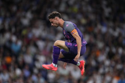 Espanyol's Javi Puado jumps during a Spanish La Liga soccer match against Real Madrid at Santiago Bernabeu stadium in Madrid, Spain, Saturday, Sept. 21, 2024. (AP Photo/Manu Fernandez)