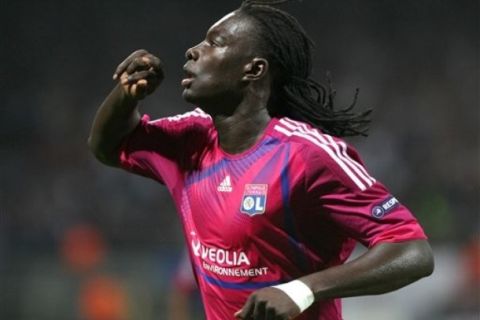 Lyon's French forward Bafetimbi Gomis reacts after scoring against Dinamo Zagreb during their Champions League Group D soccer match, at the Gerland Stadium, in Lyon, central France, Tuesday, Sept. 27, 2011. (AP Photo/Claude Paris)