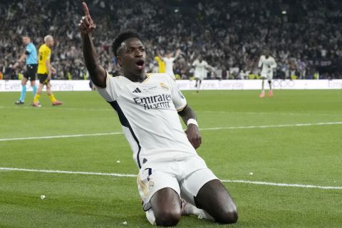 Real Madrid's Vinicius Junior celebrates after scoring his side's second goal during the Champions League final soccer match between Borussia Dortmund and Real Madrid at Wembley stadium in London, Sunday, June 2, 2024. (AP Photo/Frank Augstein)