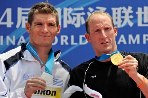 Gold medal winner Germany's Thomas Lurz (R) and silver medal winner Greece's Spyros Gianniotis (L) pose during the award ceremony for the men's 5km open water swimming event of the FINA World Championships at Jinshan beach in Shanghai on July 22, 2011. AFP PHOTO / PHILIPPE LOPEZ (Photo credit should read PHILIPPE LOPEZ/AFP/Getty Images)