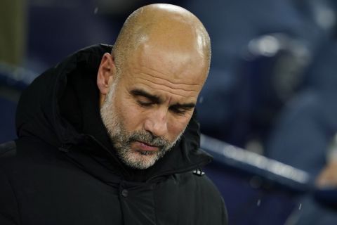 Manchester City's head coach Pep Guardiola waits for the start of the English Premier League soccer match between Manchester City and Nottingham Forest at the Etihad Stadium in Manchester, Wednesday, Dec. 4, 2024. (AP Photo/Dave Thompson)