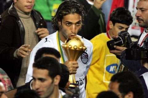 Egypt's Mido kisses the cup after Egypt won the African Nations Cup final soccer match between Egypt and Ivory Coast at the Cairo International Stadium in Egypt Friday, Feb. 10, 2006. Final score was a 4-2 penalty win for Egypt after a 0-0 draw. (AP Photo/Ben Curtis)