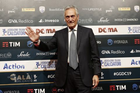 FIGC President Gabriele Gravina poses for photographer as he arrives for the Gran Gala' soccer awards ceremony, in Milan, Italy, Monday, Dec. 2, 2019. (AP Photo/Antonio Calanni)