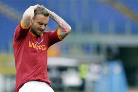 AS Roma midfielder Daniele De Rossi reacts after missing a scoring chance during the Serie A soccer match between AS Roma and Palermo, in Rome's Olympic stadium, Saturday, April 16, 2011. (AP Photo/Andrew Medichini)