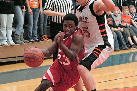 MAR 15 2010  ( SPT ) (  ) (Morgan) Christian Coleman no 23 of Constantine drives on  no 35 Wes Leonard of Fennville.
Class C Regionals Constantine Falcons  vs Fennville Blackhawks.(Jerry Campbell / Special to the Gazette).