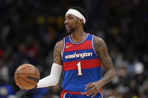 Washington Wizards guard Kentavious Caldwell-Pope (1) in action during the first half of an NBA basketball game against the Golden State Warriors, Sunday, March 27, 2022, in Washington. (AP Photo/Nick Wass)