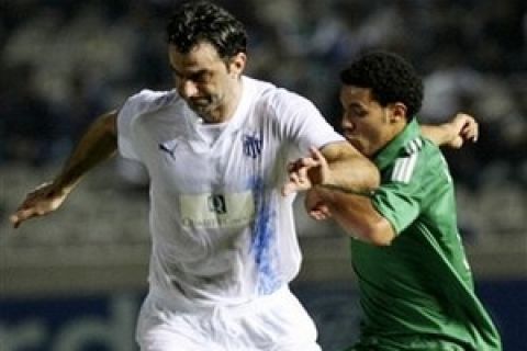 Traianos Dellas, left, of Anorthosis fights for the ball with Cleyton of Panathinaikos,  during their Group B Champions League soccer match at GSP stadium in Nicosia, Cyprus, Wednesday, Oct. 1, 2008. (AP Photo/Petros Karadjias)