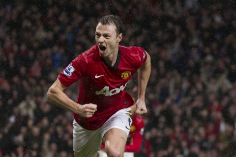 Manchester United's Jonny Evans celebrates after scoring against Newcastle during their English Premier League soccer match at Old Trafford Stadium, Manchester, England, Wednesday Dec. 26, 2012. (AP Photo/Jon Super)