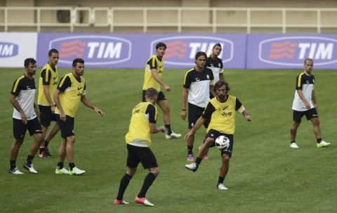 Andrea Pirlo of Juventus (2nd R) attends a training session with his teammates ahead of the Italian Super Cup soccer match against Napoli, in Beijing, August 6, 2012. REUTERS/China Daily (CHINA - Tags: SPORT SOCCER) CHINA OUT. NO COMMERCIAL OR EDITORIAL SALES IN CHINA