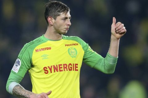 In this his picture taken on Jan. 14, 2018, Argentine soccer player, Emiliano Sala, of the FC Nantes club, western France, gives a thumbs up during a soccer match against PSG in Nantes, France. The French civil aviation authority says Emiliano Sala was aboard a small passenger plane that went missing off the coast of the island of Guernsey. (AP Photo/David Vincent)