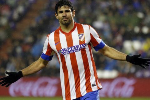 Atletico Madrid's Brazilian forward Diego da Silva Costa celebrates after scoring during the Spanish league football match Real Valladolid CF vs Atletico de Madrid at Jose Zorilla stadium in Valladolid on February 17, 2013. AFP PHOTO/ CESAR MANSO        (Photo credit should read CESAR MANSO/AFP/Getty Images)