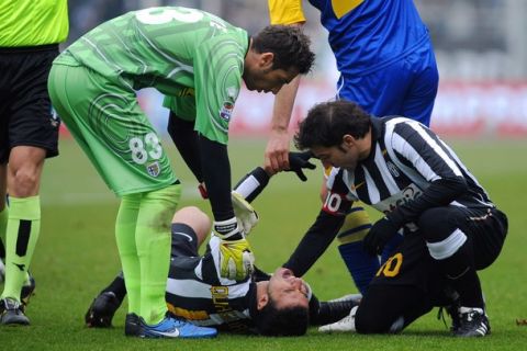 TURIN, ITALY - JANUARY 06:  Fabio Quagliarella of Juventus FC lies injured during the Serie A match between Juventus FC and Parma FC at Olimpico Stadium on January 6, 2011 in Turin, Italy.  (Photo by Valerio Pennicino/Getty Images)