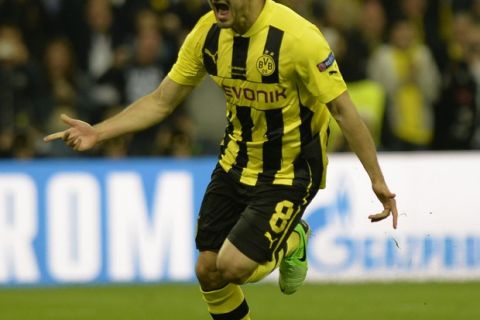 Borussia Dortmund's German midfielder Ilkay Guendogan celebrates scoring his penalty during the UEFA Champions League final football match between Borussia Dortmund and Bayern Munich at Wembley Stadium in London on May 25, 2013   AFP PHOTO / ADRIAN DENNIS        (Photo credit should read ADRIAN DENNIS/AFP/Getty Images)