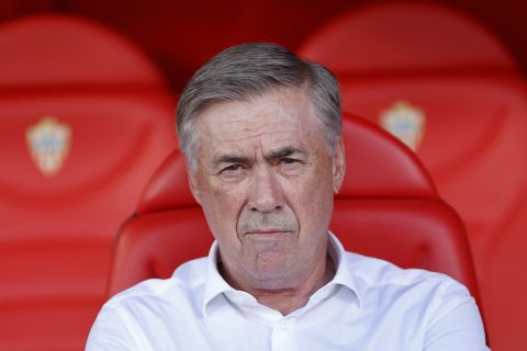 Real Madrid's head coach Carlo Ancelotti waits for the start of a Spanish La Liga soccer match between Almeria and Real Madrid at the Power Horse Stadium in Almeria, Spain, Saturday, Aug. 19, 2023. (AP Photo/Fermin Rodriguez)