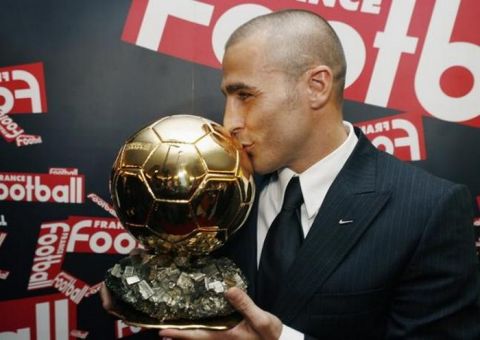 EMBARGOED FOR ONLINE NEWS UNTIL 1900 GMT
Italy's soccer player Fabio Cannavaro of Real Madrid kisses his Ballon d'Or (Golden Ball) award as European Footballer of the Year during a news conference in Paris November 27, 2006. ONLINE OUT    REUTERS/Jacky Naegelen (FRANCE)