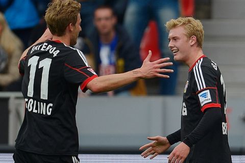 LEVERKUSEN, GERMANY - APRIL 13:  Julian Brandt of Bayer Leverkusen celebrates with team mates after scoring his team's second goal during the Bundesliga match between Bayer Leverkusen and Hertha BSC at BayArena on April 13, 2014 in Leverkusen, Germany.  (Photo by Dennis Grombkowski/Bongarts/Getty Images)