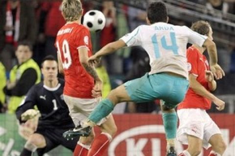 Turkey's Arda Turan, center, scores the second goal against Swiss goalkeeper Diego Benaglio, background left, during the group A match between Switzerland and Turkey in Basel, Switzerland, Wednesday, June 11, 2008, at the Euro 2008 European Soccer Championships in Austria and Switzerland. (AP Photo/Keystone, Laurent Gillieron)