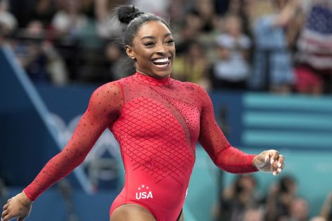 Simone Biles, of the United States, smiles after competing during the women's artistic gymnastics individual vault finals at Bercy Arena at the 2024 Summer Olympics, Saturday, Aug. 3, 2024, in Paris, France. (AP Photo/Charlie Riedel)