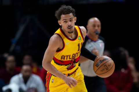 Atlanta Hawks guard Trae Young (11) is shown during the first half of an NBA basketball game against the Golden State Warriors Friday, March 25, 2022, in Atlanta. (AP Photo/Hakim Wright Sr.)