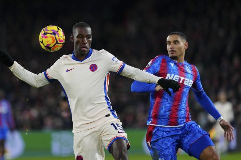 Chelsea's Nicolas Jackson controls the ball in front of Crystal Palace's Maxence Lacroix during the English Premier League soccer match between Crystal Palace and Chelsea in London, Saturday, Jan. 4, 2025. (AP Photo/Dave Shopland)