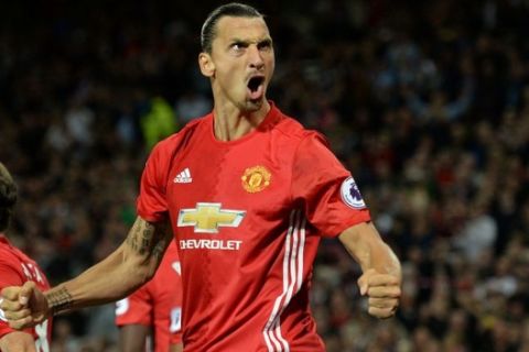 Manchester United's Swedish striker Zlatan Ibrahimovic celebrates after scoring their second goal from the penalty spot during the English Premier League football match between Manchester United and Southampton at Old Trafford in Manchester, north west England, on August 19, 2016. / AFP / Oli SCARFF / RESTRICTED TO EDITORIAL USE. No use with unauthorized audio, video, data, fixture lists, club/league logos or 'live' services. Online in-match use limited to 75 images, no video emulation. No use in betting, games or single club/league/player publications.  /         (Photo credit should read OLI SCARFF/AFP/Getty Images)