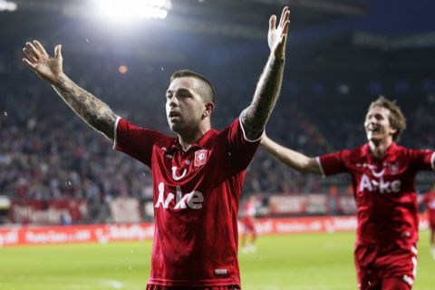 Theo Janssen (L) of FC Twente Enschede celebrates with Luuk de Jong (R) after scoring a goal against PSV Eindhoven in the Dutch League football match on April 2, 2011 in Enschede.      AFP PHOTO / VINCENT JANNINK   - netherlands out - belgium out - (Photo credit should read VINCENT JANNINK/AFP/Getty Images)