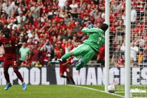 Manchester City's goalkeeper Claudio Bravo dives as the ball comes off the underside of the crossbar but does not cross the line for a goal during the Community Shield soccer match between Manchester City and Liverpool at Wembley Stadium in London, Sunday, Aug. 4, 2019. (AP Photo/Frank Augstein)