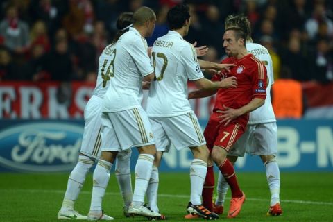 MUNICH, GERMANY - APRIL 17: Franck Ribery of Muenchen argues with Sergio Ramos, Pepe and Alvaro Arbeloa of Madrid during the UEFA Champoins League Semi Final first leg match between FC Bayern Muenchen and Real Madrid at Allianz Arena on April 17, 2012 in Munich, Germany.  (Photo by Lars Baron/Bongarts/Getty Images)