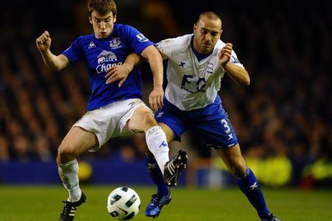 Everton's Irish defender Seamus Coleman (L) and Birmingham City's Irish defender Stephen Carr compete for the ball during their English Premier League football match at Goodison Park in Liverpool, north-west England, on March 9, 2011. AFP PHOTO/PAUL ELLIS -  FOR EDITORIAL USE ONLY Additional licence required for any commercial/promotional use or use on TV or internet (except identical online version of newspaper) of Premier League/Football League photos. Tel DataCo +44 207 2981656. Do not alter/modify photo. (Photo credit should read PAUL ELLIS/AFP/Getty Images)