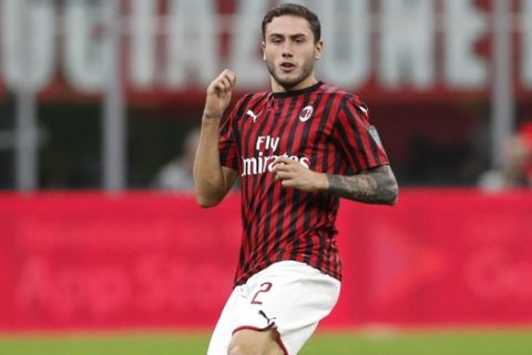 AC Milan's Davide Calabria controls the ball during a Serie A soccer match between AC Milan and Fiorentina, at the San Siro stadium in Milan, Italy, Sunday, Sept. 29, 2019. (AP Photo/Antonio Calanni)