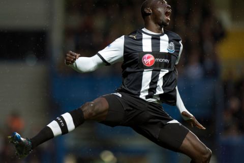 Newcastle United's Papiss Cisse celebrates after scoring the opening goal against Chelsea during the English Premier League football match at Stamford Bridge in London on May 2, 2012. AFP PHOTO / ADRIAN DENNIS

RESTRICTED TO EDITORIAL USE. No use with unauthorized audio, video, data, fixture lists, club/league logos or live services. Online in-match use limited to 45 images, no video emulation. No use in betting, games or single club/league/player publications.ADRIAN DENNIS/AFP/GettyImages