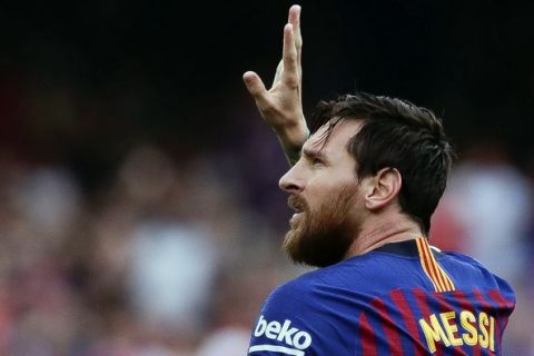 Barcelona's Lionel Messi celebrates scoring the opening goal during a Spanish La Liga soccer match between Barcelona and Huesca at the Camp Nou stadium in Barcelona, Spain, Sunday Sept. 2, 2018. (AP Photo/Eric Alonso)