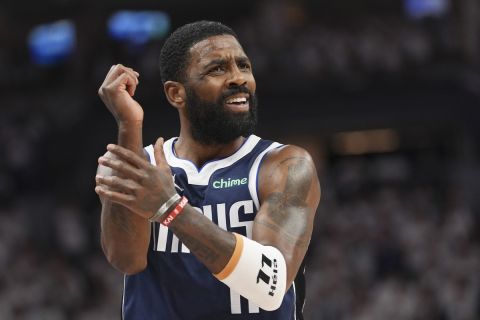 Dallas Mavericks guard Kyrie Irving (11) argues a no call during Game 1 of the NBA basketball Western Conference finals against the Minnesota Timberwolves, Wednesday, May 22, 2024, in Minneapolis. (AP Photo/Abbie Parr)