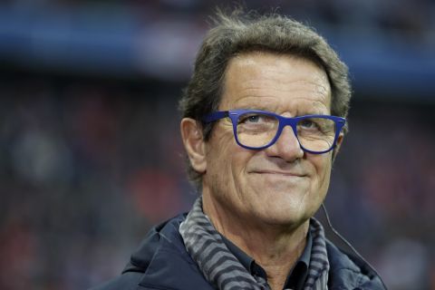 Soccer coach Fabio Capello arrives for the German Bundesliga soccer match between FC Bayern Munich and Borussia Moenchengladbach at the Allianz Arena stadium in Munich, Germany, Saturday, Oct. 22, 2016. (AP Photo/Matthias Schrader)