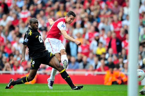 Arsenal's Dutch striker Robin Van Persie (R) scores the opening goal of the English Premier League football match between Arsenal and Bolton Wanderers at The Emirates Stadium in north London, England on September 24, 2011. AFP PHOTO/GLYN KIRK

RESTRICTED TO EDITORIAL USE. No use with unauthorized audio, video, data, fixture lists, club/league logos or live services. Online in-match use limited to 45 images, no video emulation. No use in betting, games or single club/league/player publications. (Photo credit should read GLYN KIRK/AFP/Getty Images)