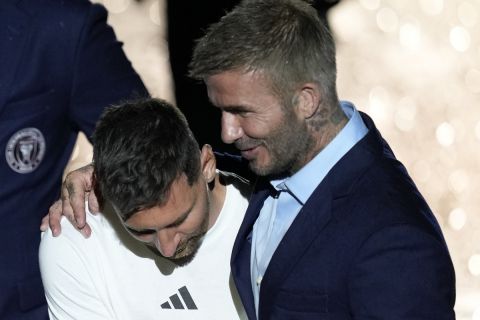 Inter Miami's Lionel Messi, left, embraces team co-owner David Beckham during a celebration by the team at DRV PNK Stadium, Sunday, July 16, 2023, in Fort Lauderdale, Fla. It comes one day after Messi, Major League Soccer and Inter Miami finalized his signing through the 2025 season. (AP Photo/Rebecca Blackwell)