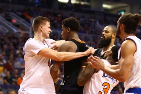 Dec 13, 2016; Phoenix, AZ, USA; New York Knicks forward Kristaps Porzingis (left) pushes Phoenix Suns forward Marquese Chriss as they fight in the third quarter at Talking Stick Resort Arena. Mandatory Credit: Mark J. Rebilas-USA TODAY Sports ORG XMIT: USATSI-324100 ORIG FILE ID:  20161213_mjr_su5_022.JPG