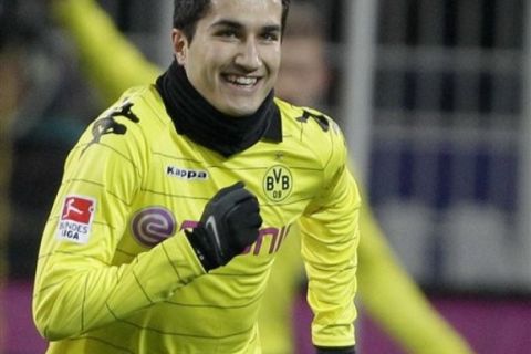 Dortmund's Nuri Sahin of Turkey celebrates after scoring during the German first division Bundesliga soccer match between Borussia Dortmund and Werder Bremen in Dortmund, Germany, Saturday, Dec. 11, 2010. (AP Photo/Frank Augstein) ** NO MOBILE USE UNTIL 2 HOURS AFTER THE MATCH, WEBSITE USERS ARE OBLIGED TO COMPLY WITH DFL-RESTRICTIONS, SEE INSTRUCTIONS FOR DETAILS **