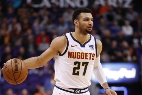 Denver Nuggets guard Jamal Murray (27) against the Phoenix Suns during the first half of an NBA basketball game, Saturday, Dec. 29, 2018, in Phoenix. (AP Photo/Matt York)