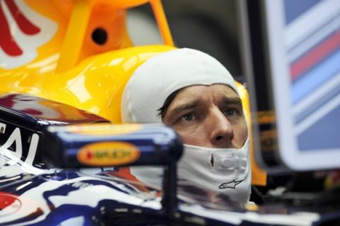 Red Bull Formula One driver Mark Webber of Australia sits in his car in the pit during the second practice session of the Belgian F1 Grand Prix in Spa-Francorchamps, August 26, 2011.     REUTERS/Jan Van De Vel (BELGIUM - Tags: SPORT MOTOR RACING)