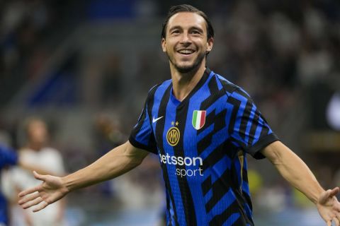 Inter Milan's Matteo Darmian celebrates after scoring his side's opening goal during a Serie A soccer match between Inter Milan and Lecce, at the San Siro stadium in Milan, Italy, Saturday, Aug. 24, 2024. (AP Photo/Luca Bruno)