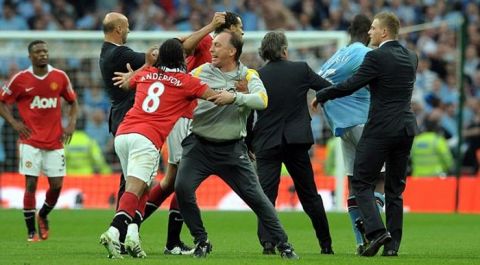 Mario Balotelli and Manchester United's Anderson argue after the final whistle as Roberto Mancini Manager and Assistant coach David Platt rush onto the pitch to sepearate the players
Manchester City 2010/11
Manchester City V Manchester United (1-0) 16/04/11
The FA Cup Semi Final at Wembley Stadium
Photo: Robin Parker Fotosports International
