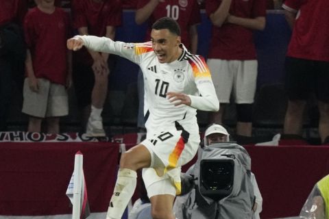 Germany's Jamal Musiala celebrates after scoring his side's second goal during a round of sixteen match between Germany and Denmark at the Euro 2024 soccer tournament in Dortmund, Germany, Saturday, June 29, 2024. (AP Photo/Frank Augstein)