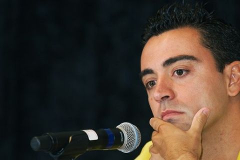 FC Barcelona player Xavi listens to a reporter's question as he holds a press conference on July 28, 2011, in Washington, DC. Barcelona faces Manchester United on July 30 in a friendly match at RFK Stadium in Washington. AFP Photo/Paul J. Richards (Photo credit should read PAUL J. RICHARDS/AFP/Getty Images)