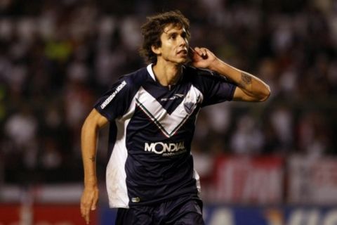 Argentina's Velez Sarsfield's Ricardo Alvarez celebrates after scoring during a Copa Libertadores soccer game against Ecuador's Liga Deportiva Universitaria in Quito, Ecuador, Thursday, May 5, 2011. (AP Photo/Dolores Ochoa)