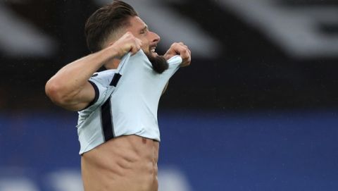 Chelsea's Olivier Giroud reacts after a missed scoring opportunity during the English Premier League soccer match between Crystal Palace and Chelsea at Selhurst Park, in London, England, Tuesday, July 7, 2020. (Peter Cziborra/Pool via AP)