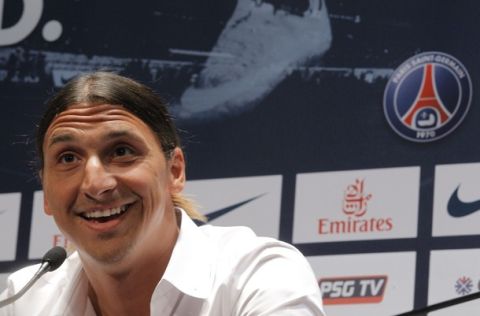 AC Milan striker Zlatan Ibrahimovic, of Sweden, smiles during a press conference at the Parc des Princes stadium in Paris, Wednesday, July 18, 2012 after signing an agreement with the Paris Saint Germain (PSG) club. Ibrahimovic will be the Ligue 1 club's third major signing of the summer, following the arrivals of former AC Milan teammate Thiago Silva and Napoli's Ezequiel Lavezzi. (AP Photo/Jacques Brinon)