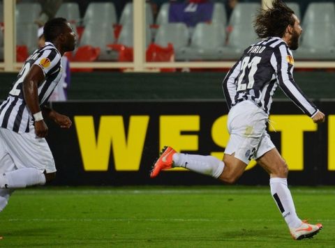 Juventus' midfielder Andrea Pirlo (R) celebrates after scoring a free kick during UEFA Europa League round of 16, second-leg football match Fiorentina vs Juventus at Artemio Franchi stadium in Florence on Marc 20, 2014.    AFP PHOTO/ VINCENZO PINTO        (Photo credit should read VINCENZO PINTO/AFP/Getty Images)