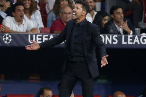 Atletico coach Diego Simeone, right, reacts during a Group A Champions League soccer match between Atletico Madrid and Club Brugge at the Wanda Metropolitano stadium in Madrid, Spain, Wednesday Oct. 3, 2018. (AP Photo/Paul White)