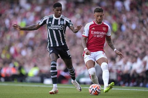 Manchester United's Marcus Rashford, left, and Arsenal's Ben White vie for the ball during the English Premier League soccer match between Arsenal and Manchester United at Emirates stadium in London, Sunday, Sept. 3, 2023. (AP Photo/Kirsty Wigglesworth)